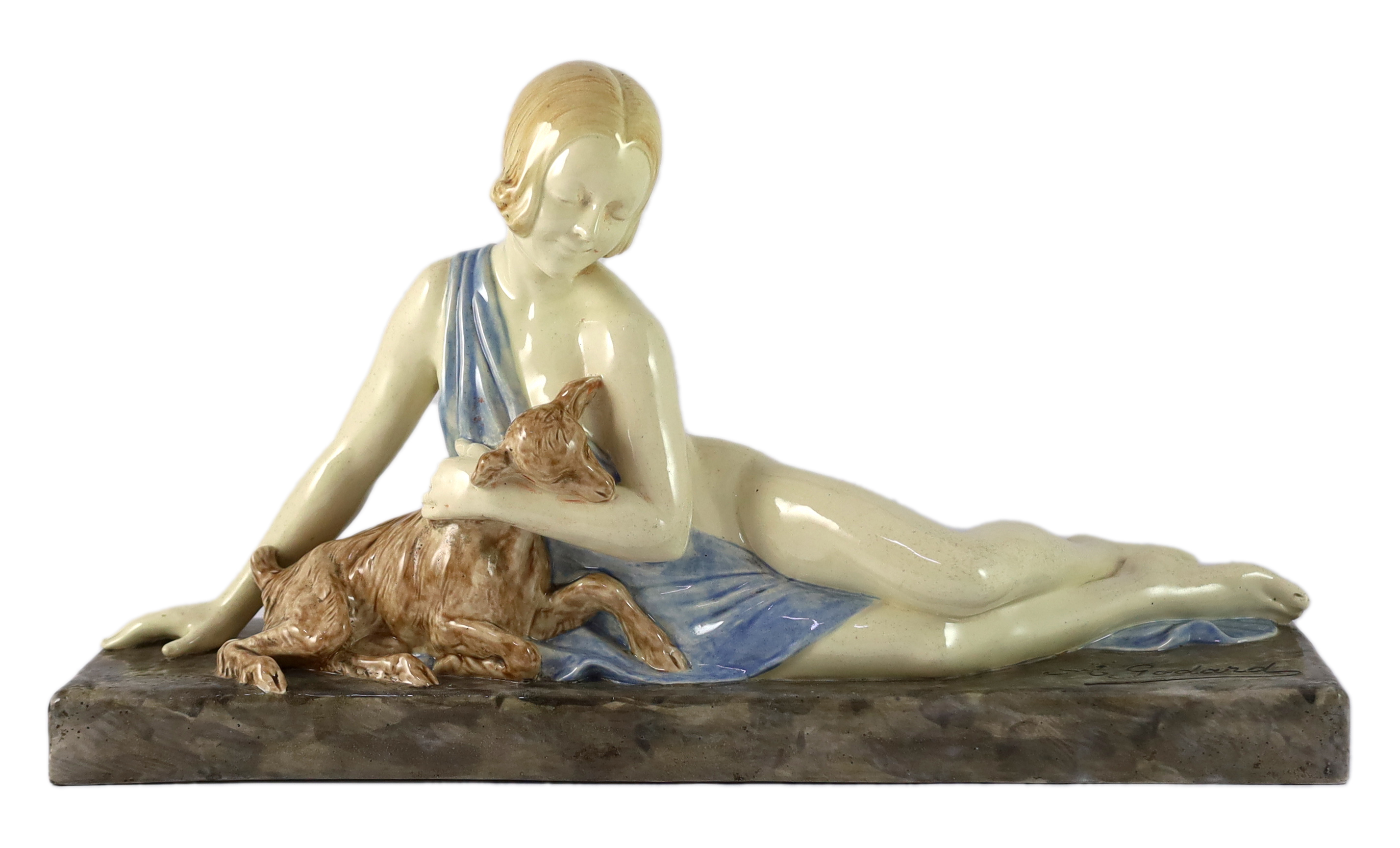 Armand Godard (French, 1824-1887). An Art Deco ceramic group of a reclining beauty with a kid